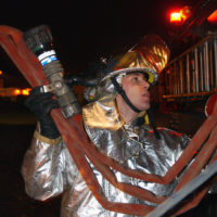 A firefighter operates a water hose during the Major Accident Response  Exercise (MARE) - NARA & DVIDS Public Domain Archive Public Domain Search