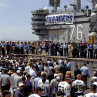 060811-N-7526R-093 (Aug. 11, 2006)San Diego Chargers running back LaDanian  Tomlinson (56) looks on as his team conduct awalk-throughon the flight  deck aboard US Navy (USN) Nimitz Class Aircraft Carrier USS RONALD REAGAN (